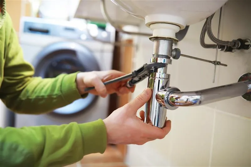 Licensed plumber in Ballwin MO performing residential plumbing repair